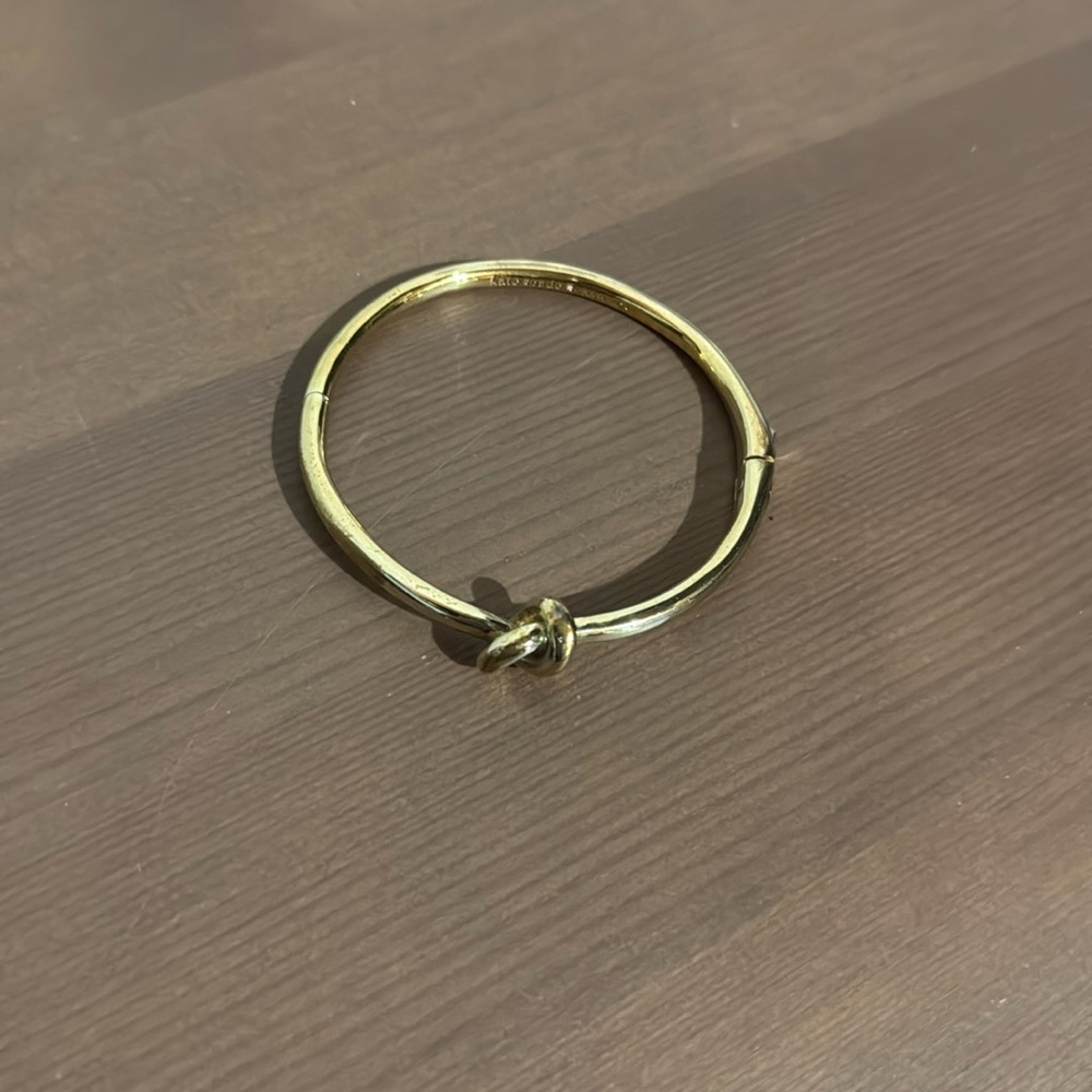 Kate Spade gold tone knot bracelet